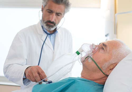 Patient in hospital wearing an non rebreather oxygen mask